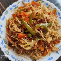 A picture of Veg Red Chilli Hakka Noodles.