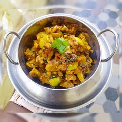 A picture of Hare Tamatar Ki Sabzi / Green tomato Curry.