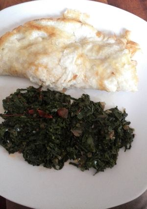 A picture of Omelet with fried kale.