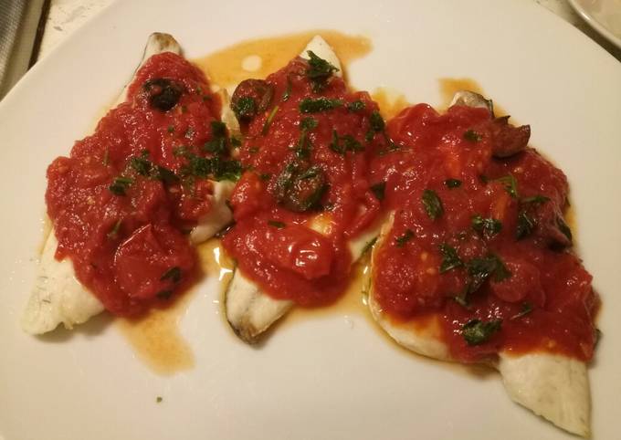 Sea bass with tomato and olive sauce