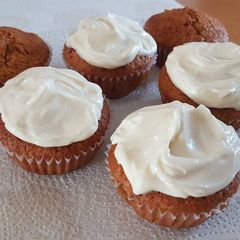 A picture of Vanilla Cupcakes with Cream Cheese frosting.