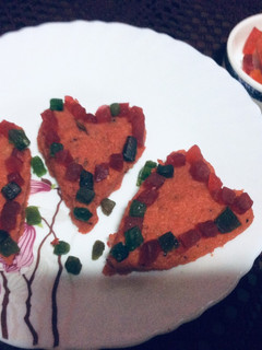 A picture of Heart shape spicy upma.