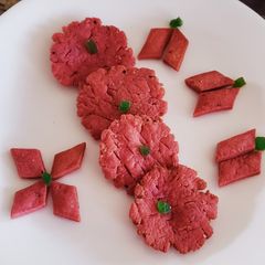 A picture of Beetroot farsi puri and shakkarpara.