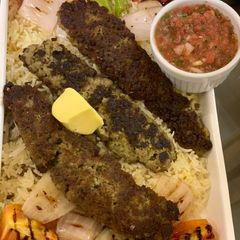 A picture of Chullu kabab with butter saffron rice.