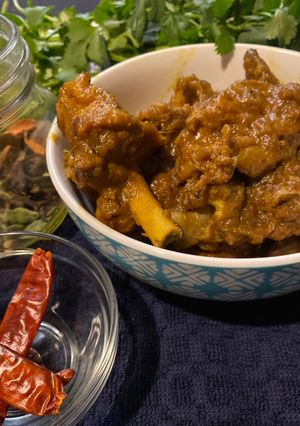 A picture of Country style chicken with chili (murghir laal jhol).