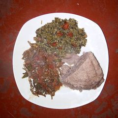A picture of Fried Omena, Kienyeji and brown Ugali.