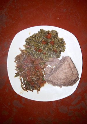 A picture of Fried Omena, Kienyeji and brown Ugali.