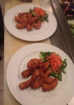 Una foto de Camarones al Coco