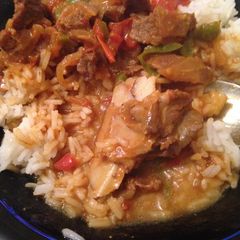 A picture of Beef stewed with  rice.