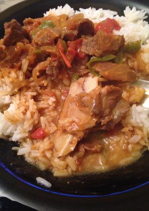 A picture of Beef stewed with  rice.