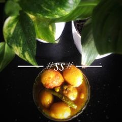 A picture of Egg curry with baby potatoes & green peas #Cookpad.