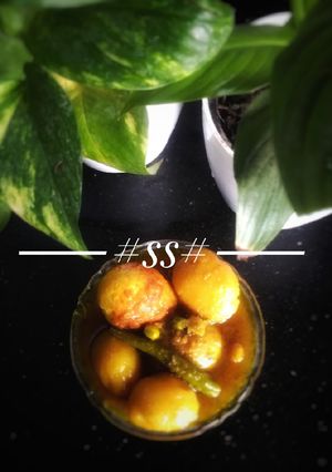 A picture of Egg curry with baby potatoes & green peas #Cookpad.