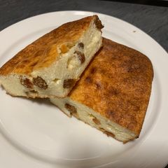 A picture of Ricotta casserole with raisins.
