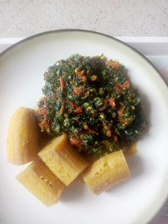 A picture of Boiled unripe plantain with veg sauce.
