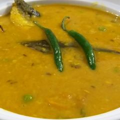 মাছের মাথা দিয়ে মুগের ডাল A picture of মাছের মাথা দিয়ে মুগের ডাল.