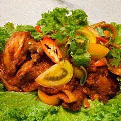 A picture of Ayam Masak Merah Malaysia (Chicken in spicy tomato sauce).