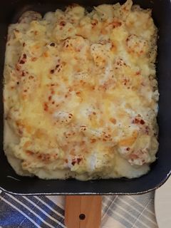 Una foto de Coliflor con bechamel de jamón gratinada