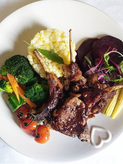 A picture of Creamy samp with lamb chops and steamed veggies.