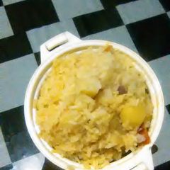 A picture of Turmeric rice with potatoes.