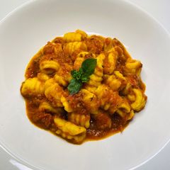 A picture of Homemade Gnocchi with Pizza/Pasta Sauce.