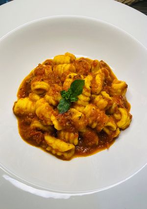A picture of Homemade Gnocchi with Pizza/Pasta Sauce.