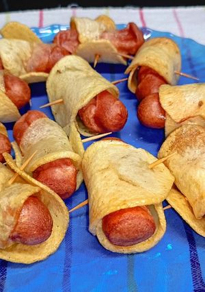 Una foto de Salchichas envueltas en papas
