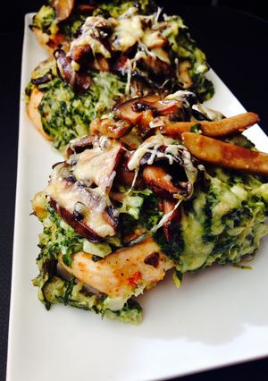 A picture of Chicken Breasts with Creamed Spinach and Buttered Mushrooms.