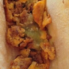 A picture of Delicious Chorizo Con Huevo y Salsa Verde.