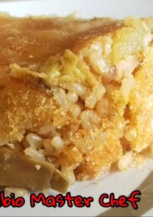 A picture of Brown Rice Timballo with Artichokes and Baked Potatoes.