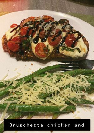 A picture of Bruschetta Chicken with Garlicky Parmesan Green Beans.