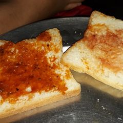 A picture of Sandwich of veg mayonnaise, pasta topping.