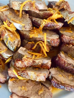 A picture of Duck breasts fillet with orange sauce.