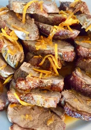 A picture of Duck breasts fillet with orange sauce.