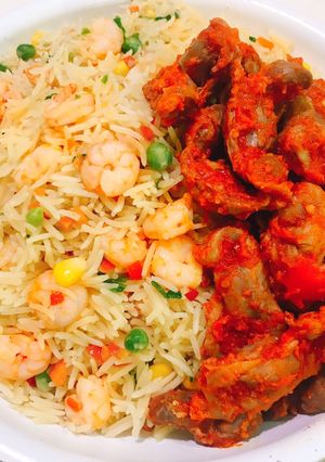 A picture of Shrimp stirred fried rice and peppered gizzards.