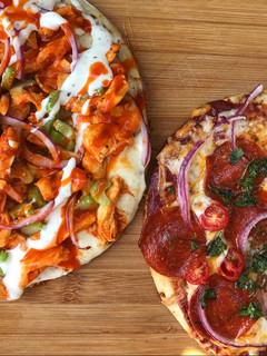 A picture of Buffalo style + pepperoni pizza.
