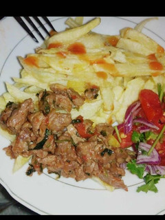 A picture of Beef chips with kachumbari.