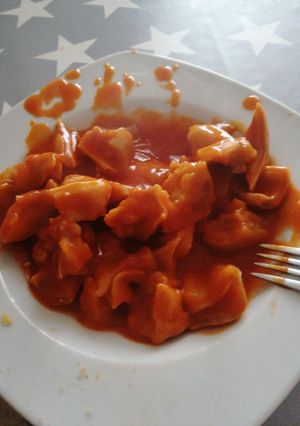 Una foto de Oreja de cerdo versión con tomate