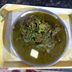 A picture of Palak kofta with palak grevy.