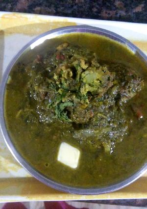 A picture of Palak kofta with palak grevy.