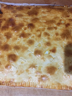 Una foto de Empanada de jamón York, queso y bacon
