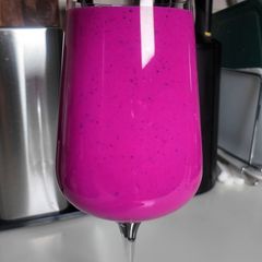 Neon pink dragon fruit smoothie, no protein powder A picture of Neon pink dragon fruit smoothie, no protein powder.