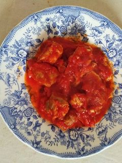 Una foto de Costilla con panceta y tomate