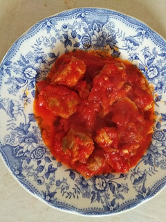 Una foto de Costilla con panceta y tomate