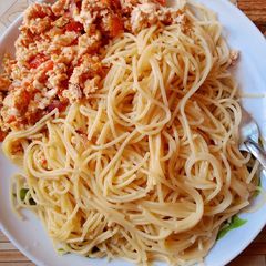 A picture of Spaghetti with fried eggs.