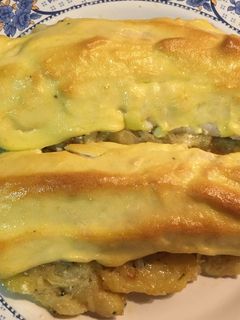 Una foto de Merluza gratinada en cama de patata