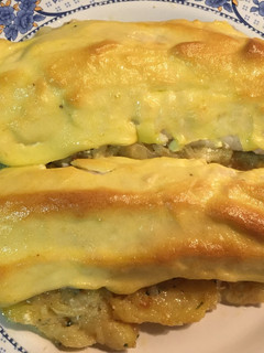Una foto de Merluza gratinada en cama de patata
