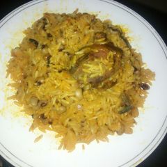A picture of Jollof palm oil rice and beans.