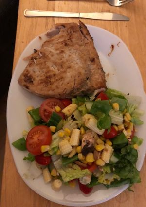 A picture of Wine poached swordfish salad.