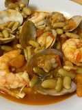 Verdinas con langostinos y almejas