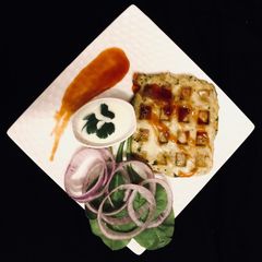 A picture of Cheese chicken spinach waffle.